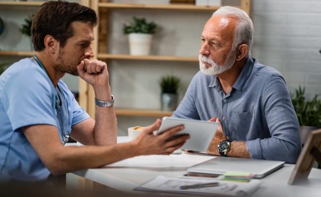 Medical professional speaking with a patient