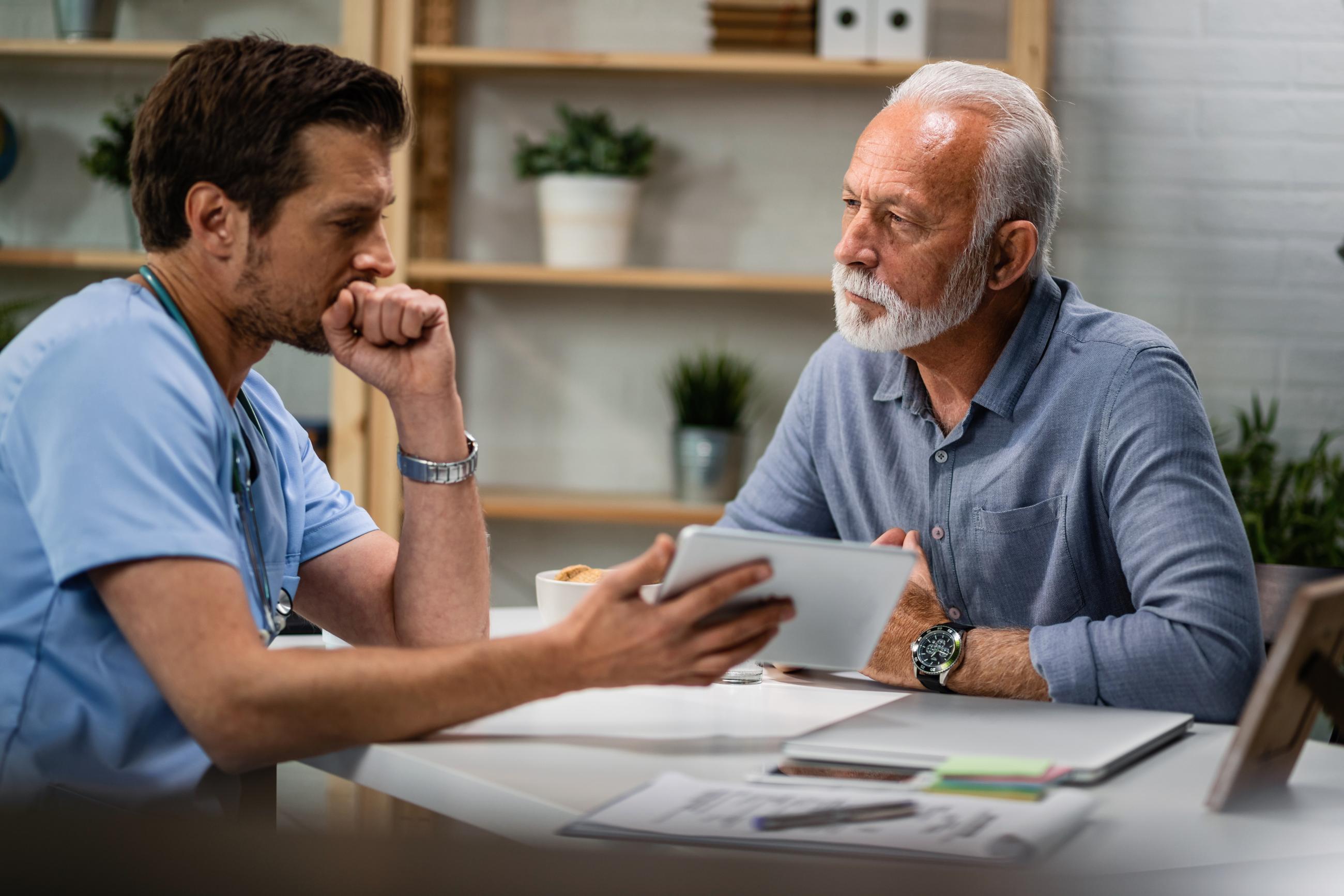 Medical professional speaking with a patient